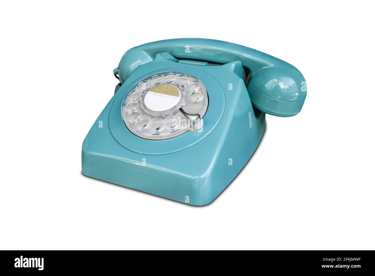 Türkisfarbenes Drehschalter Telefon aus den siebziger Jahren. Isoliert über Weiß Stockfoto