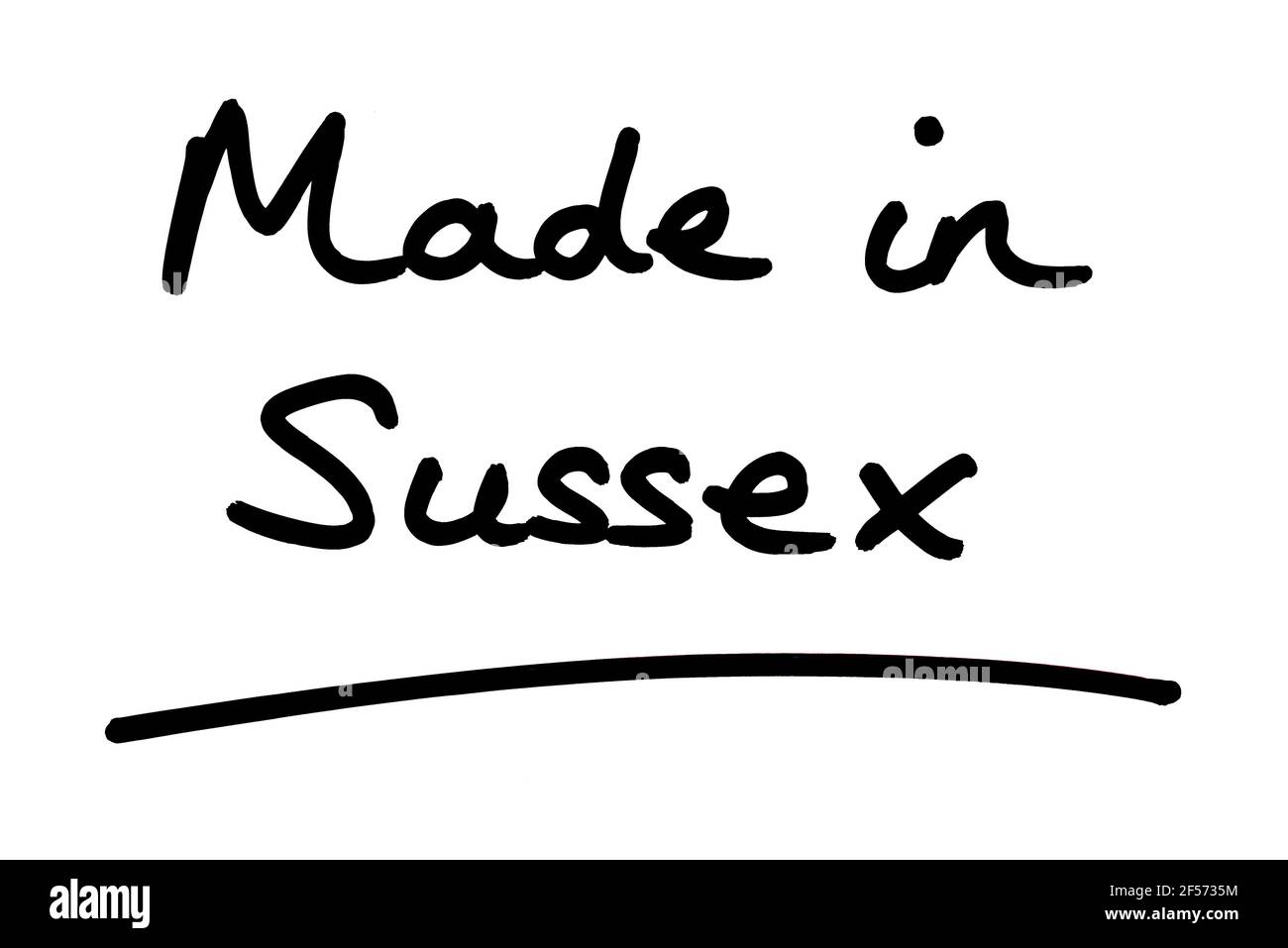 Hergestellt in Sussex, handgeschrieben auf weißem Hintergrund. Stockfoto