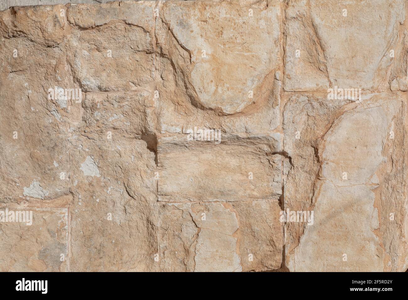 goldene gelbe Steinwand, Hintergrundstruktur Stockfoto