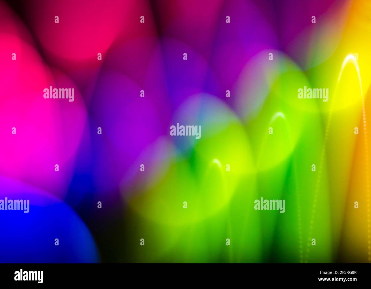 Glänzender, farbenfroher Hintergrund. Licht Malerei mit Kugeln. Zusammenfassung Stockfoto