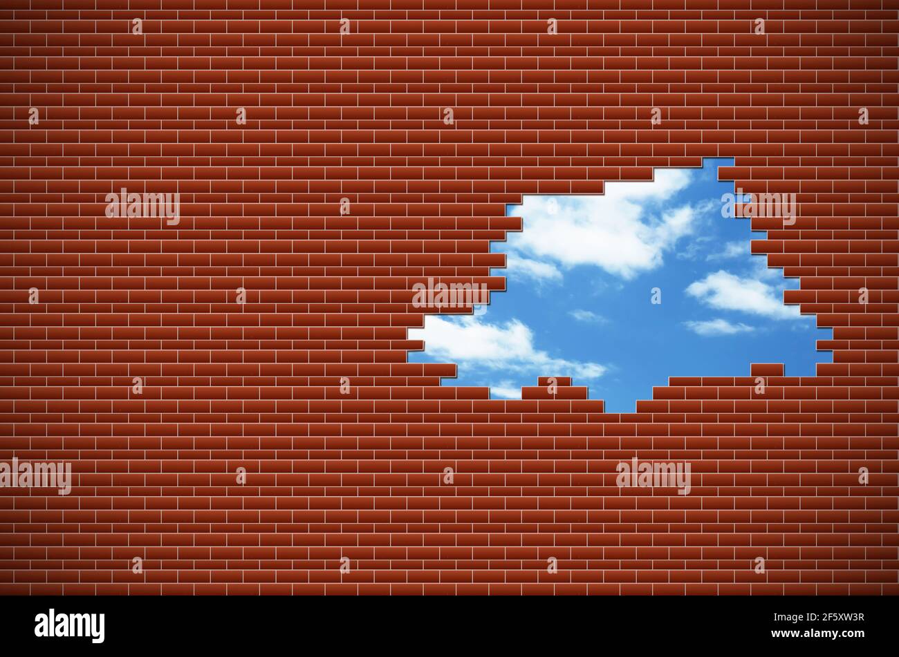 Abstrakt von blauem Himmel mit Wolken in einem Loch in einer Ziegelmauer. Horizontal. Stockfoto