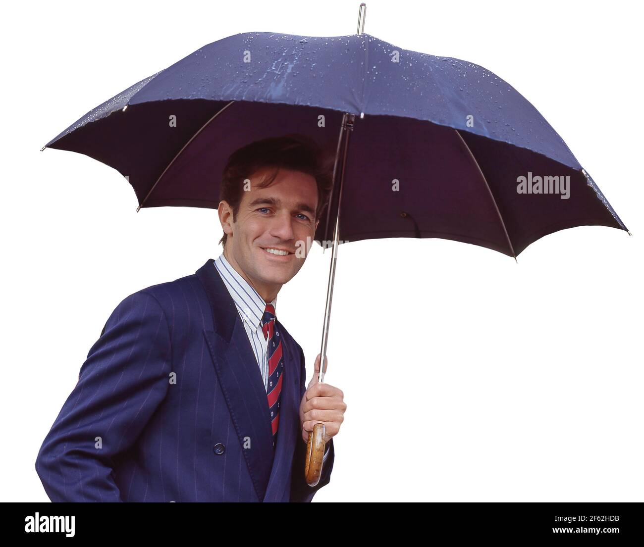 Geschäftsmann mit Regenschirm in der Straße, Liverpool Street Station, City of London, London, England, Vereinigtes Königreich Stockfoto