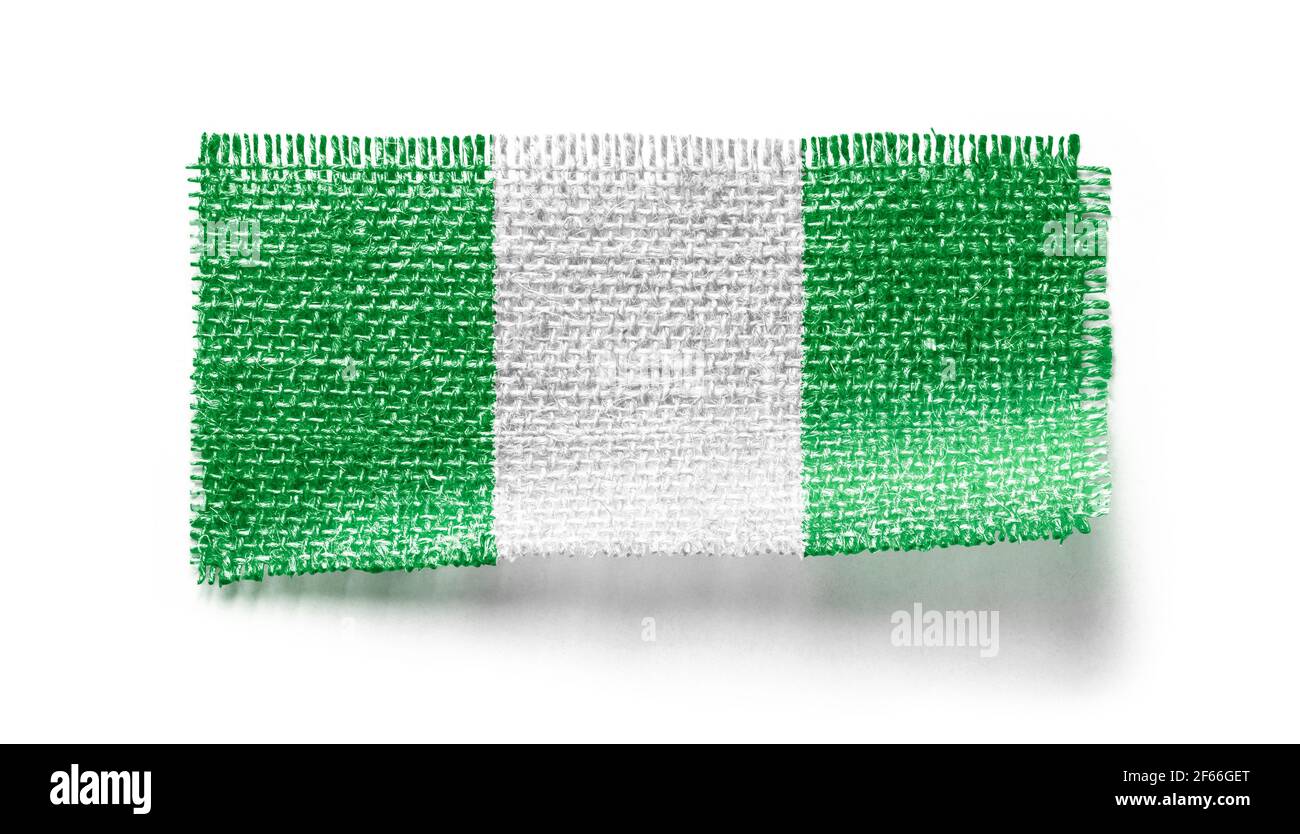 Nigeria Flagge auf einem Stück Stoff auf einem weißen Hintergrund Stockfoto