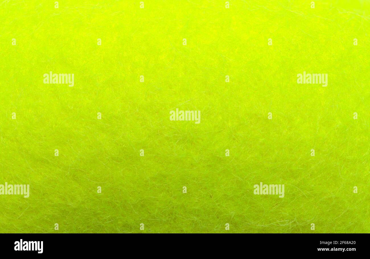 Green Tennis Ball Nahaufnahme Textur Hintergrund. Stockfoto