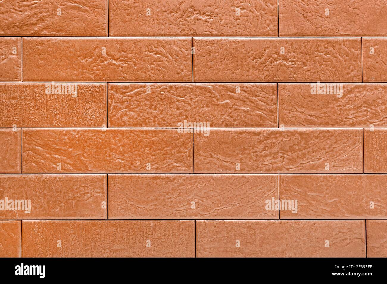 Braune Backsteinwand außen moderne innere Textur Fassade Hintergrund. Stockfoto