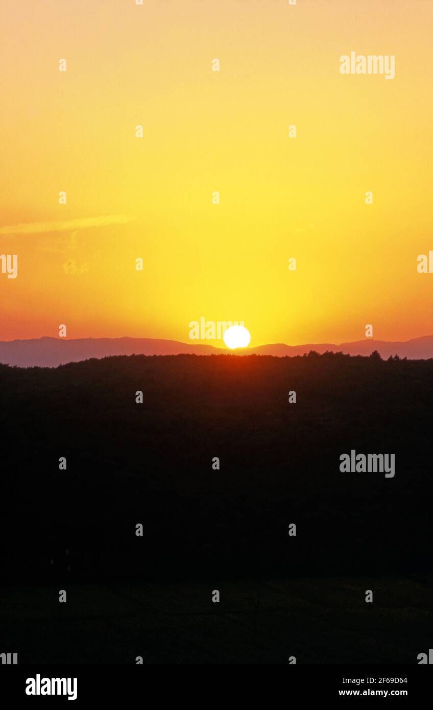 Sonne über den Hügeln der Toskana, Italien Stockfoto