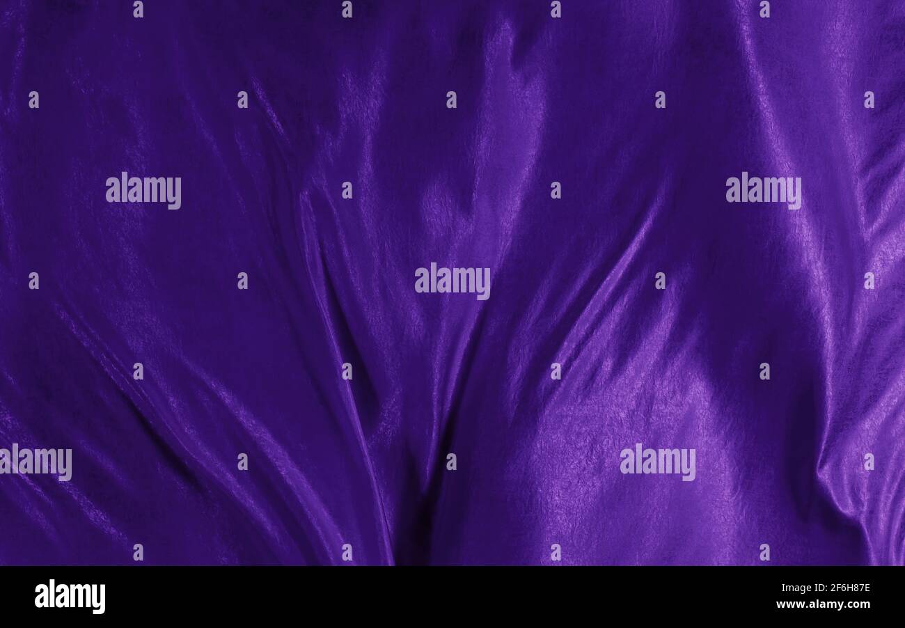 Abstrakter Hintergrund violette Seide oder Satin Luxus Stoff Textur Stockfoto