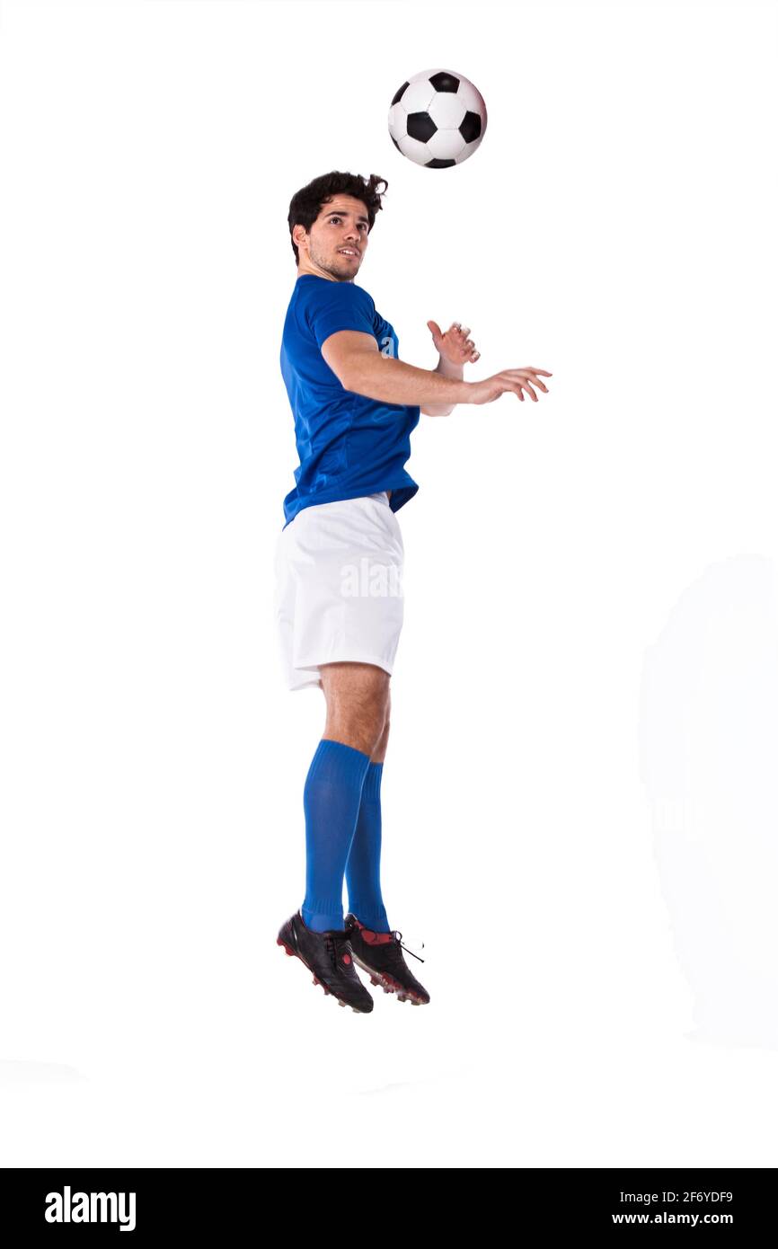 Fußball-Spieler mit einem Fußball Stockfoto