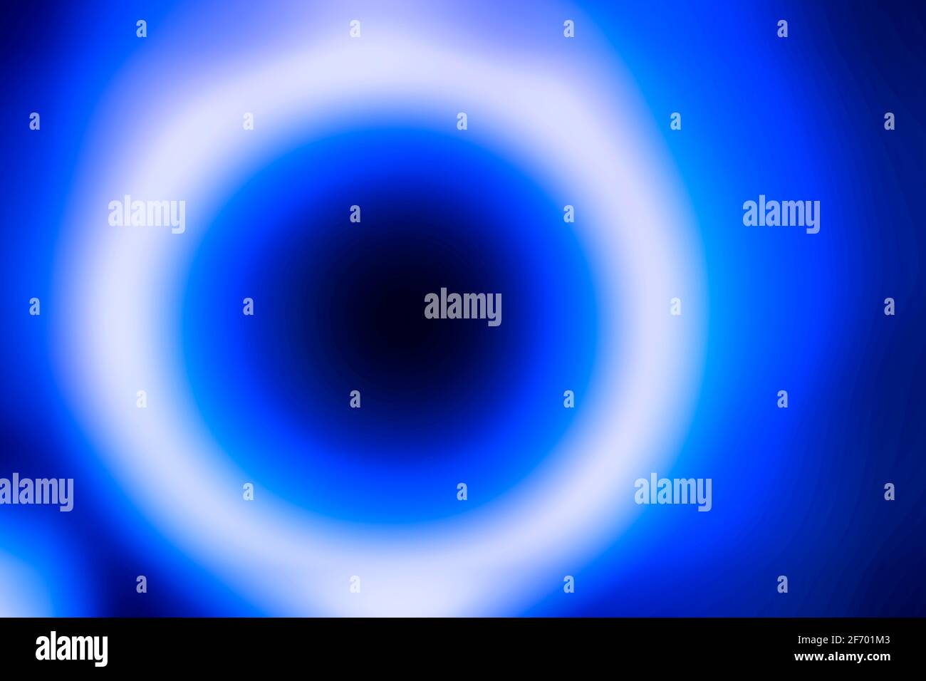 Blaue und weiße Kreise machen eine verschwommene Bewegung abstrakt strukturiert Hintergrund Stockfoto