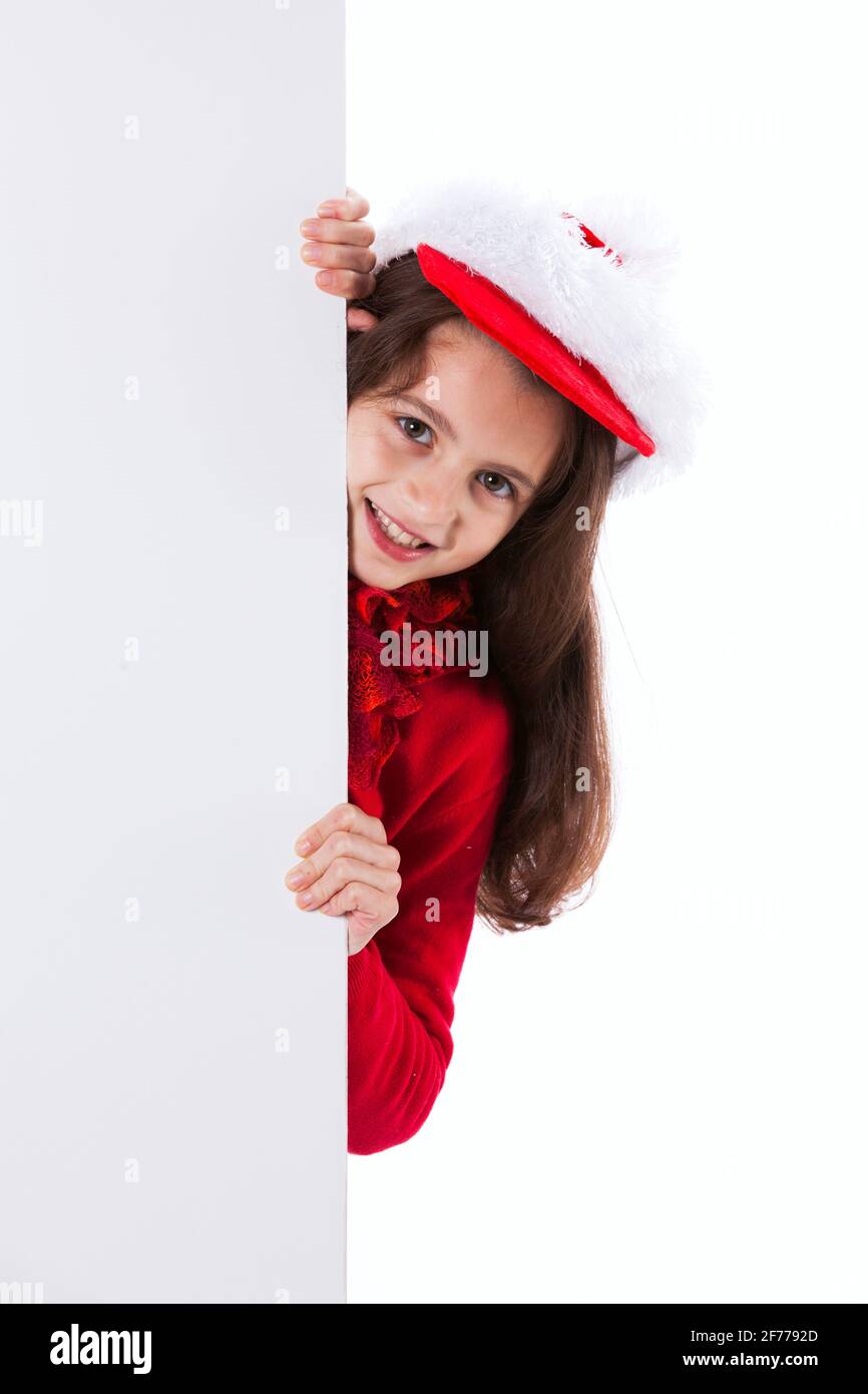 Kleines Mädchen mit einem weihnachtsmannhut Stockfoto