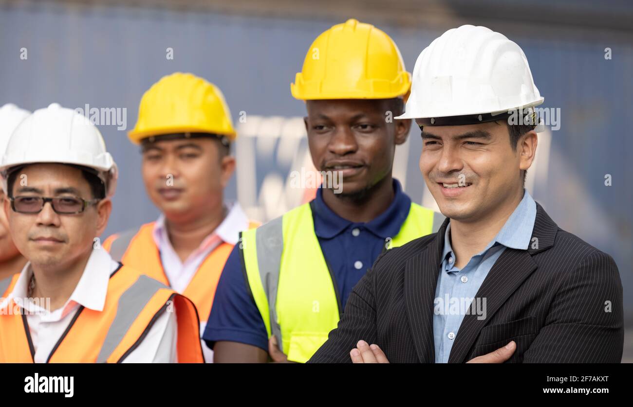 Unity and Success Concept.Bottom view of Engineer Team People Standing Hands Holding together at the Container Yard. Stockfoto