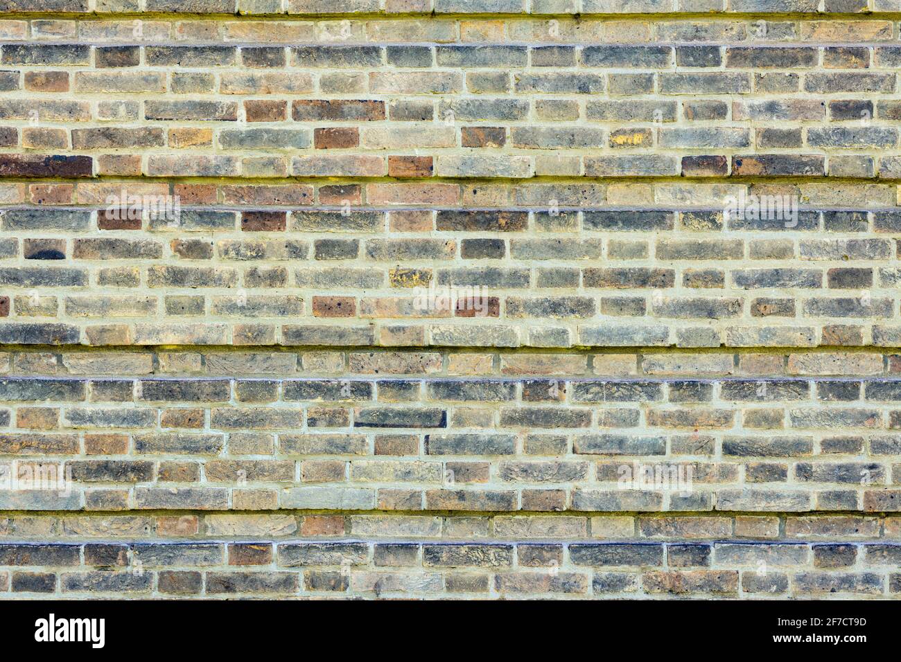 Gemusterte Ziegelwand Hintergrund Vielzahl von Ziegelsteinen Ziegelwand gemacht Mit normalen neuen Hausziegeln Foto in hoher Auflösung und hoher Qualität Stockfoto