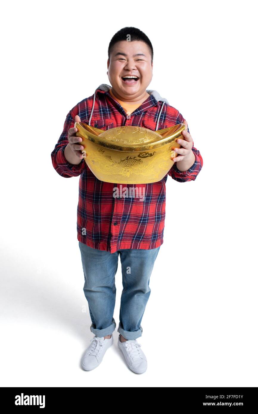 Junger Mann feiert Chinesisches Neujahr Stockfoto