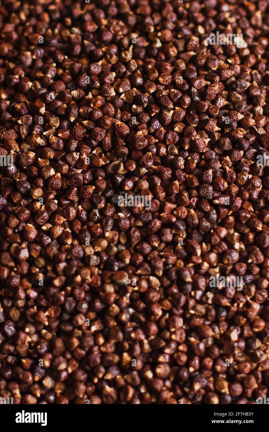 Schwarze Pfefferkörner, Pfefferkörner Samen auf einem Hintergrund Nahaufnahme Makro Stockfoto