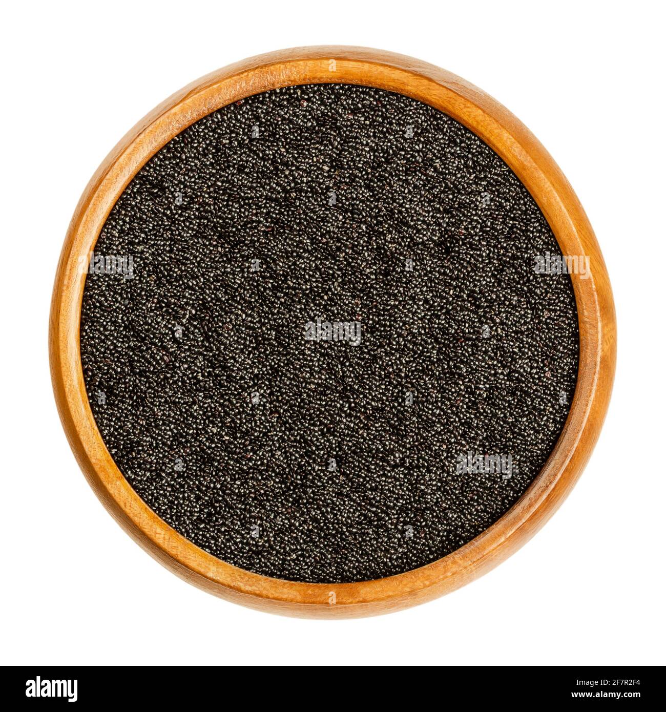 Schwarzes Amaranth-Korn in einer Holzschale. Samen von Amaranthus, einem pseudozeralen, Hauptnahrungsmittel und Proteinquelle der Azteken, verboten von Konquistadoren. Stockfoto