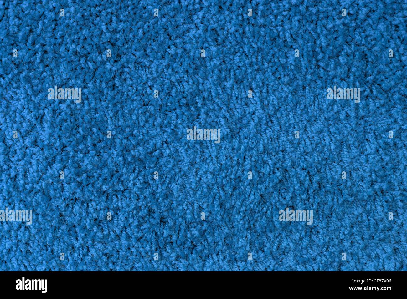 Beuty Muster monochrome Textur der Oberfläche des blauen Stoffteppichs mit Fäden mit Kopierraum, leer und leer. Stockfoto
