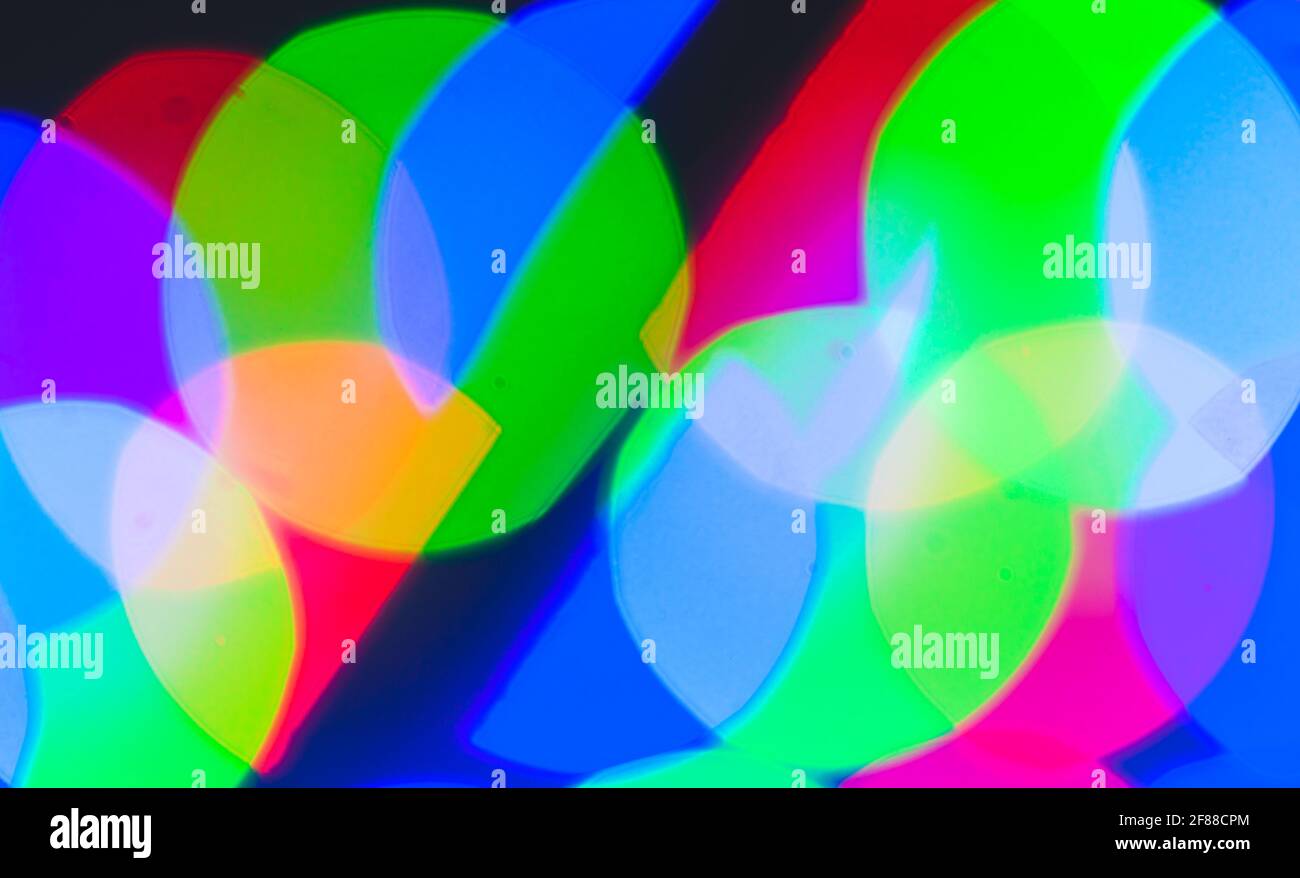 Verschwommenes RGB-LED-Licht, geometrischer Bokeh-Effekt. Abstrakte bunte Hintergrund Foto Textur Stockfoto