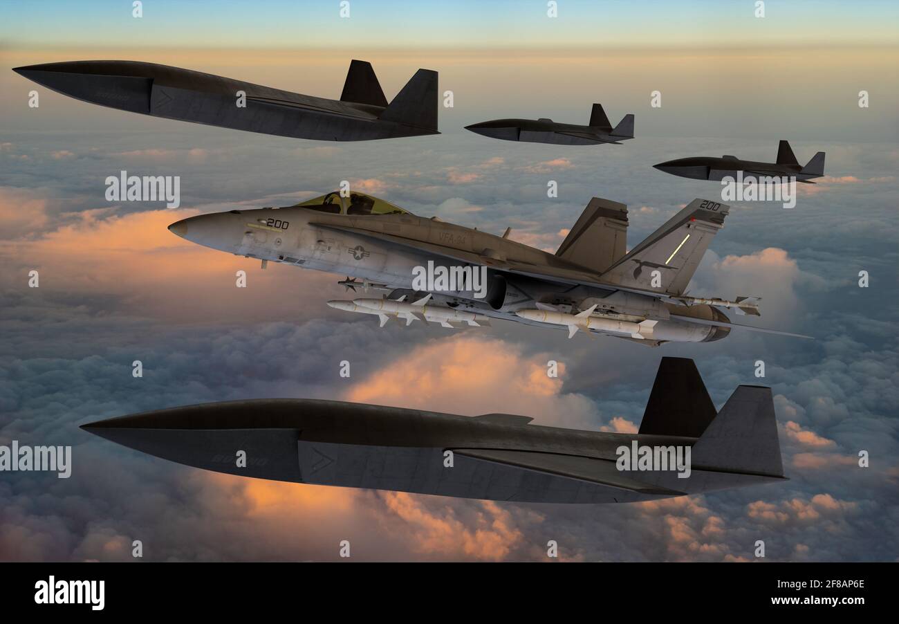 Mysliwce F-18 unterstützt von Drohnen des experimentellen treuen Wingman Programm durchgeführt von Boeing Stockfoto