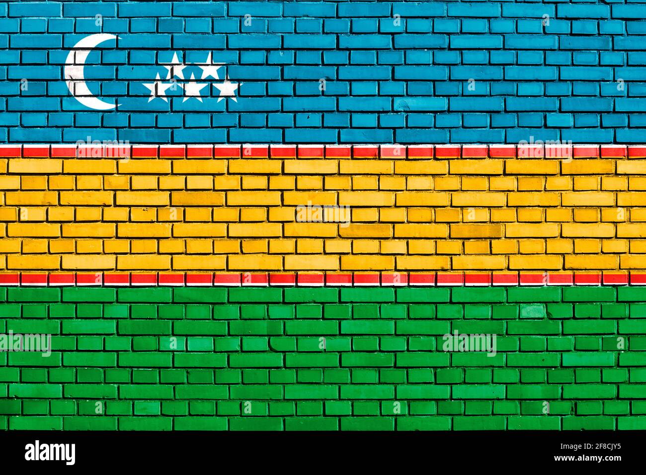 Flagge von Karakalpakstan auf Ziegelmauer gemalt Stockfoto