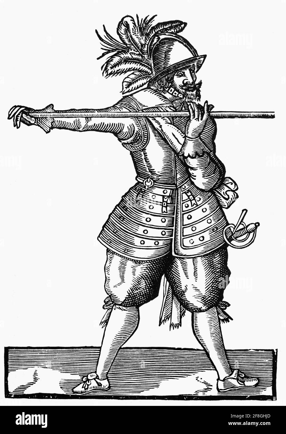 Ein Hecht aus dem 17. Jahrhundert im Kleid von Cromwells New Model Army. Trotz der Einführung von Musketen spielte der Hecht eine wichtige Rolle beim Schutz der Musketiere vor Kavallerieeinheiten. Der Hecht ist im Grunde ein sehr langer, stanziger Speer, der früher vom späten Mittelalter bis zum frühen 18. Jahrhundert von der Infanterie ausgiebig eingesetzt wurde und von Fußsoldaten aus nächster Nähe eingesetzt wurde. Sie wurden schließlich durch Gewehre ersetzt, die eine größere Reichweite hatten und an denen ein Bajonett befestigt werden konnte. Stockfoto