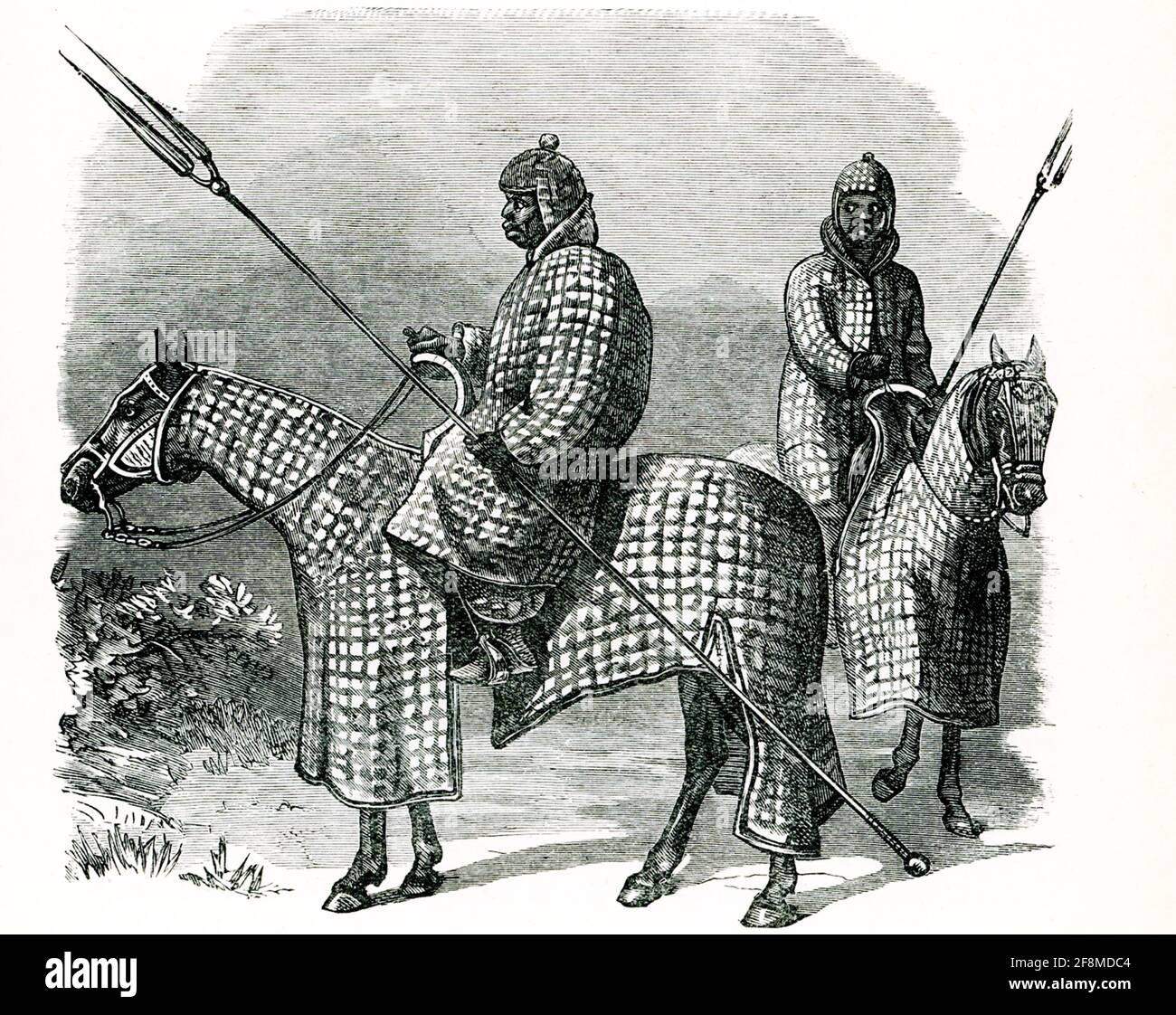 Diese Abbildung aus dem Jahr 1914 zeigt Begharmi-Lancer. Beide sind Kavallerie, alle mit einer Lanze und in gesteppter Rüstung auf einem Pferd sitzend, auch in gesteppter Rüstung. Begharmi befand sich am östlichen Ufer des Tschadsees in der Zentralsavanna. Stockfoto