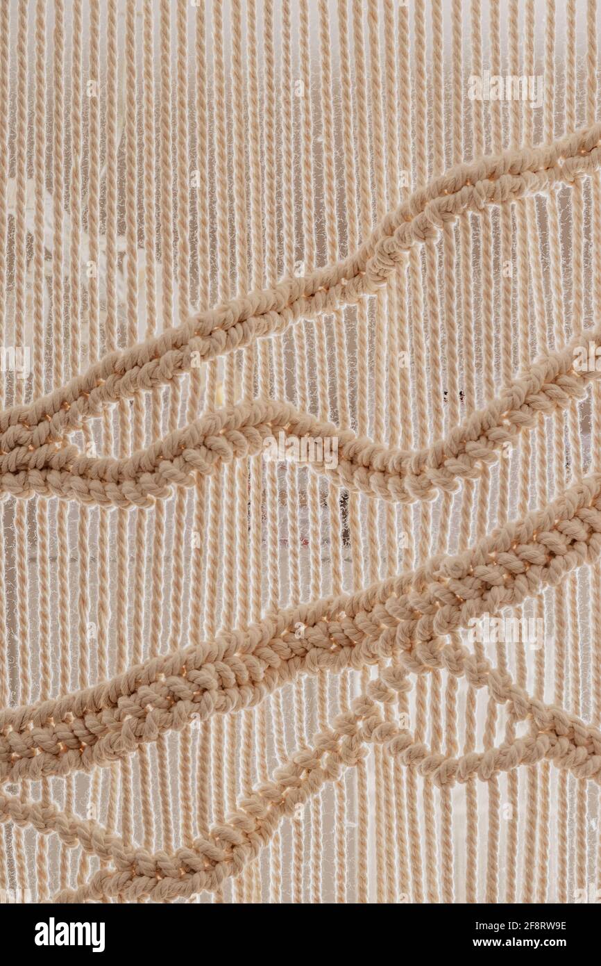Hausgemachte weiße Macrame-Textur. Startseite scandinavian Boho Dekoration Hintergrund Stockfoto