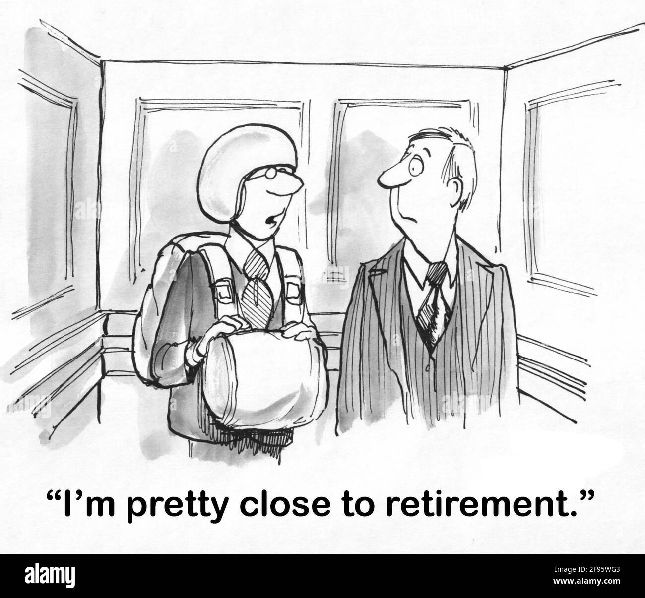 Der Manager trägt einen Fallschirm im Aufzug, während er sich auf den Ruhestand vorbereitet. Stockfoto