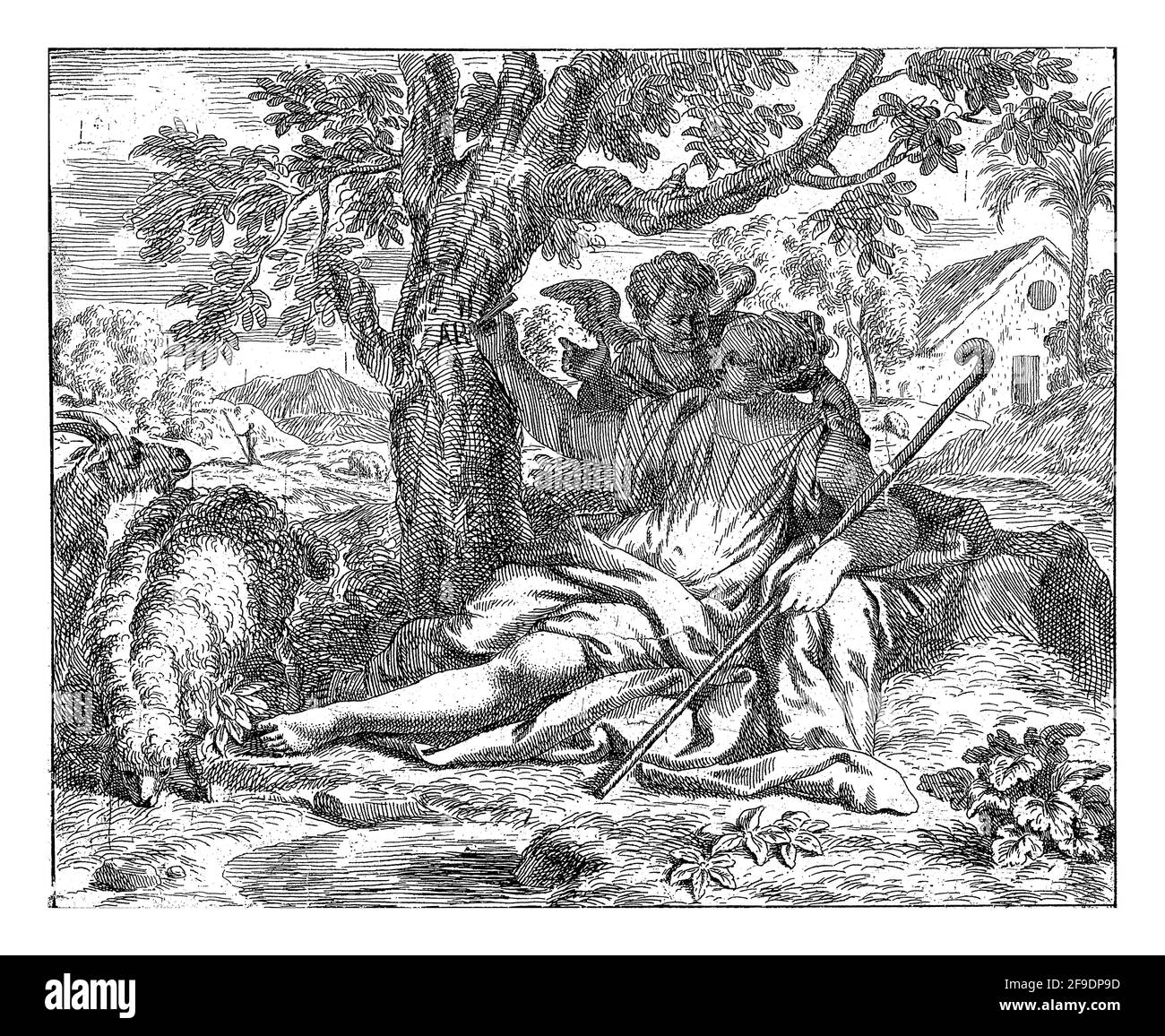 Landschaft mit Hager, am Fuße eines Baumes gelegen. Sie hält einen Stab in ihrer linken Hand und schreibt mit ihrer rechten Hand die Buchstaben A R in den Kofferraum Stockfoto