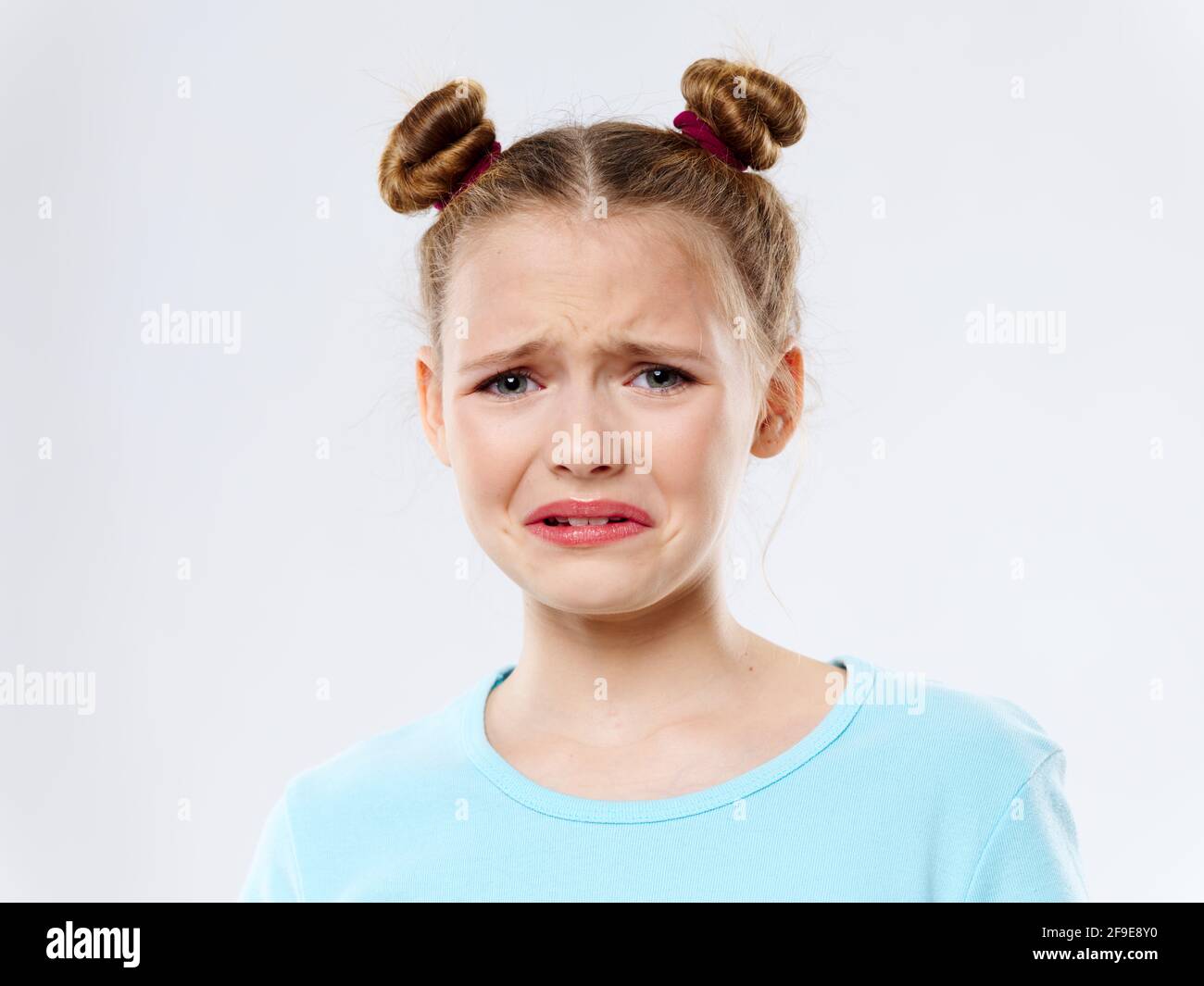 Mädchen mit Zöpfen weinende Emotion Störung close-up Stockfoto