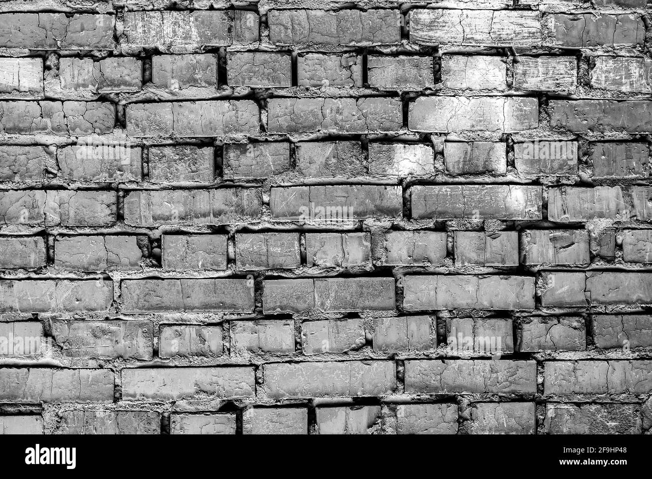 Mauerwerk in Graustufen. Textur einer alten Ziegelmauer. Stockfoto