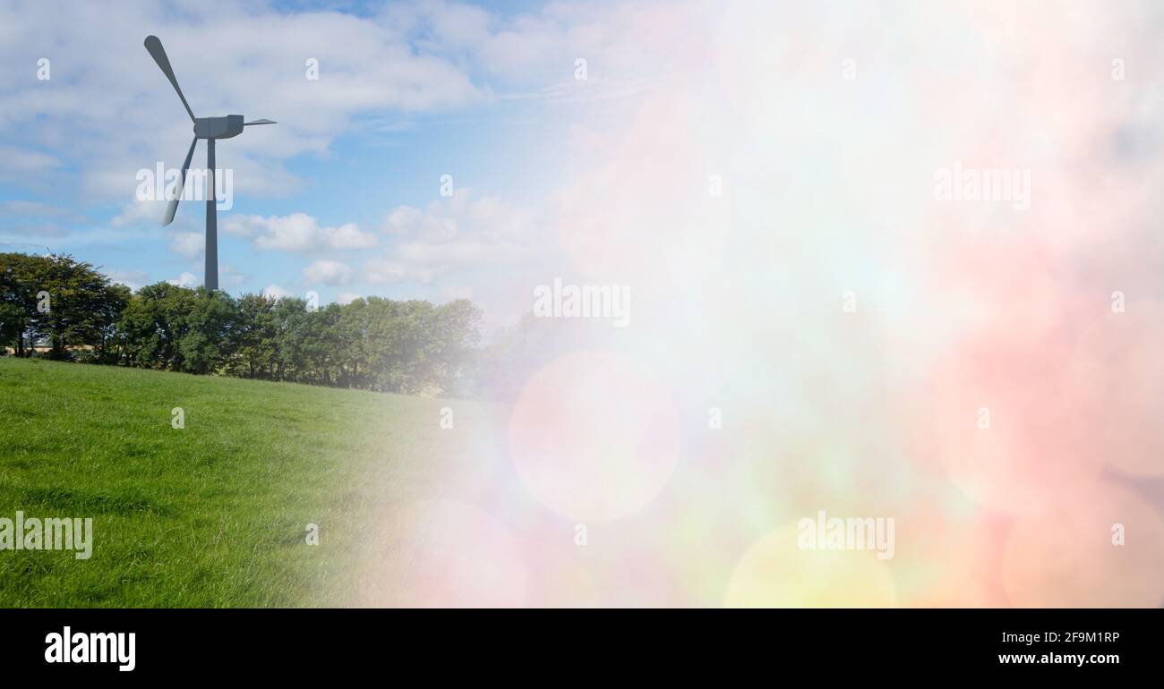 Zusammensetzung der Windturbine auf dem Land mit rosa Rauch Stockfoto