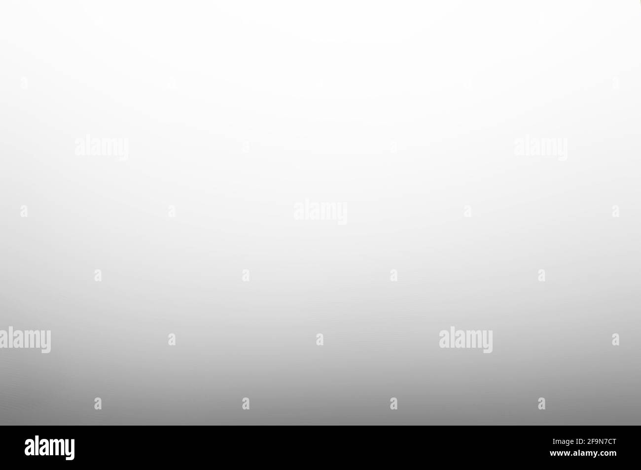 Verlauf glatter abstrakter weißgrauer Hintergrund Stockfoto