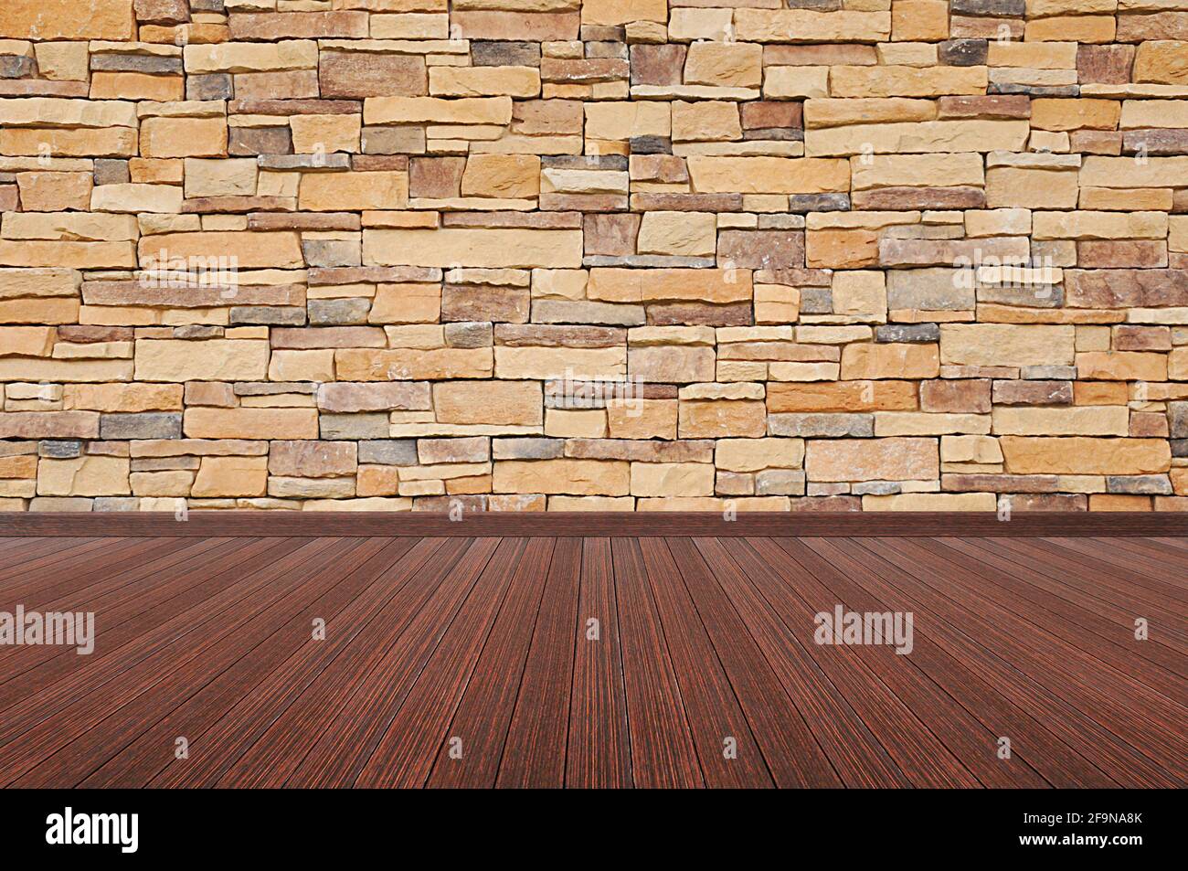 Holzboden mit Steinwand - leerer Raum im Hintergrund Stockfoto