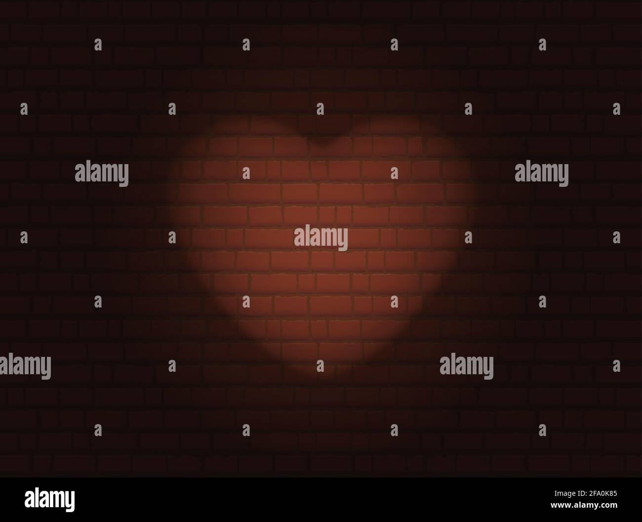 Herzwand. Spotlight eines Herzens auf einer Backsteinmauer. Stockfoto