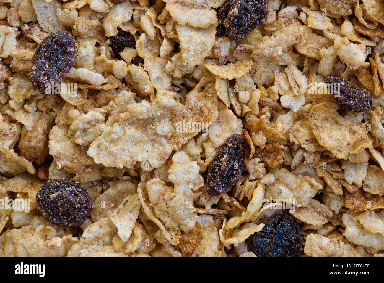 Trockenes Getreide Vollkorn mit Rosinen, Müsli und Haferflocken Faser Frühstück Konzept Hintergrundbild. Stockfoto