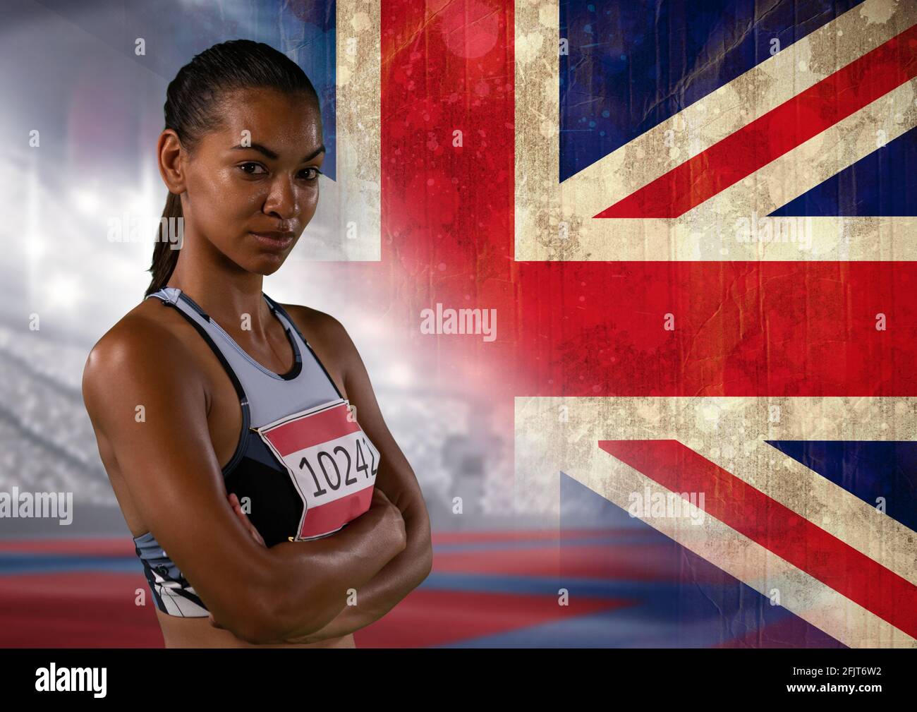 Porträt einer afroamerikanischen Athletin gegen die britische Flagge Und Sportstadion Stockfoto