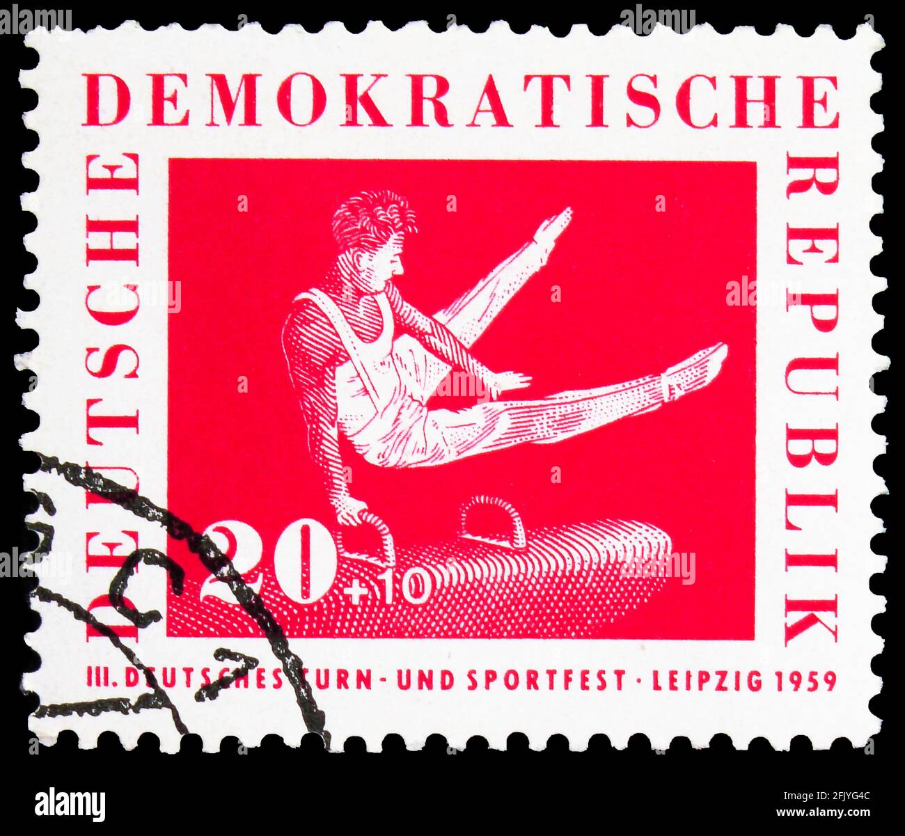 MOSKAU, RUSSLAND - 27. SEPTEMBER 2019: Briefmarke gedruckt in Deutschland, Demokratische Republik, zeigt Gymnastik auf dem Pauschenpferd, Leipziger Sportfest Stockfoto
