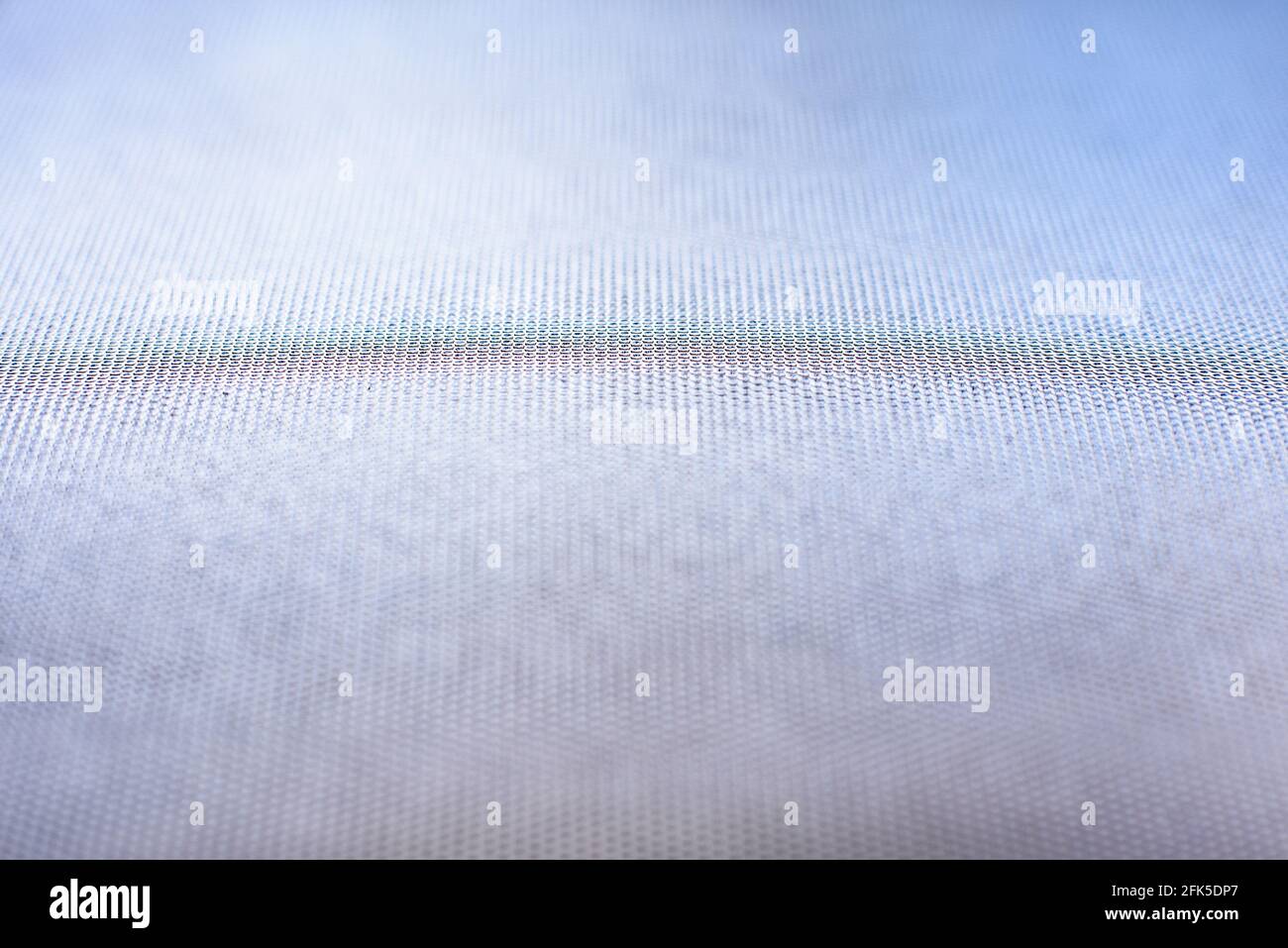 Abstrakter Hintergrund mit kleinen Punkten in der Mitte und fokussiert Blaue Töne an den Rändern unscharf Stockfoto