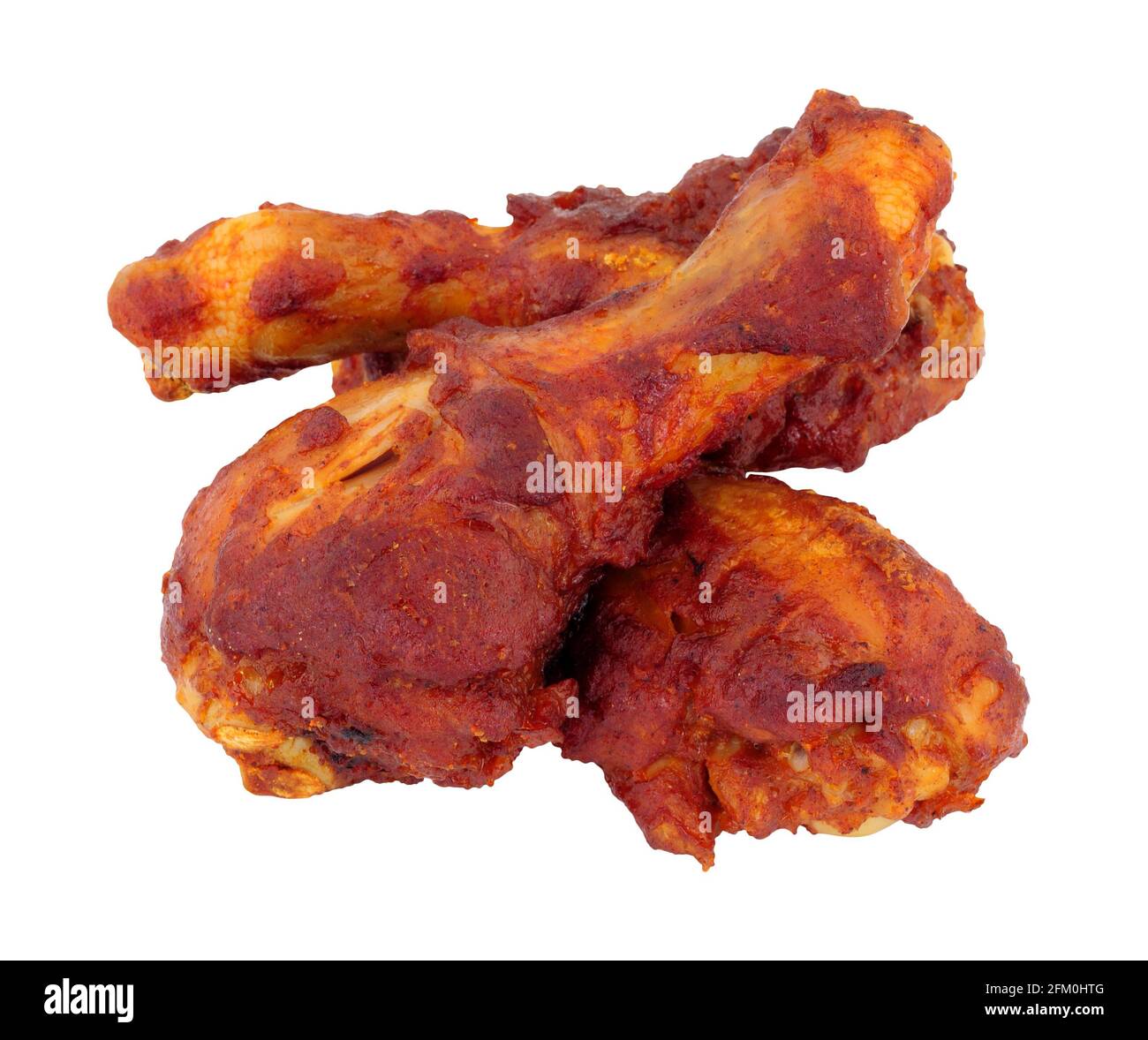 Gekochte Grillsauce marinierte Hähnchenschenkel auf einem weißen isoliert Hintergrund Stockfoto