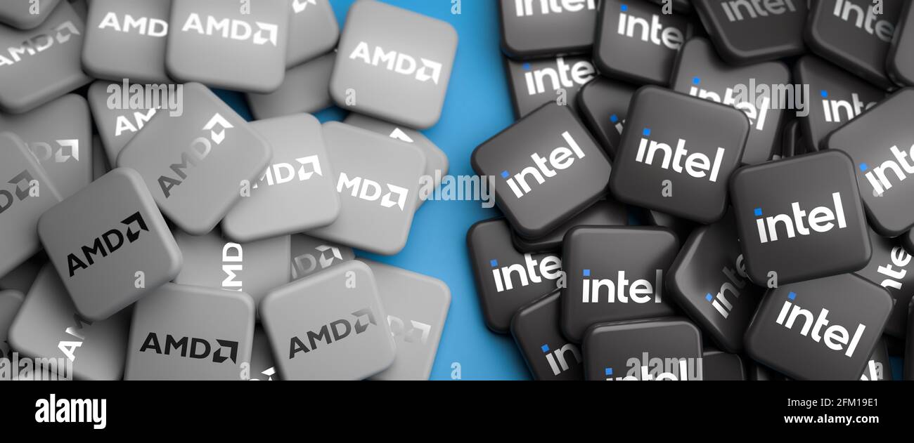 Logos der konkurrierenden Technologieunternehmen Intel und AMD auf Haufen auf einem Tisch. Webbanner-Format. Stockfoto