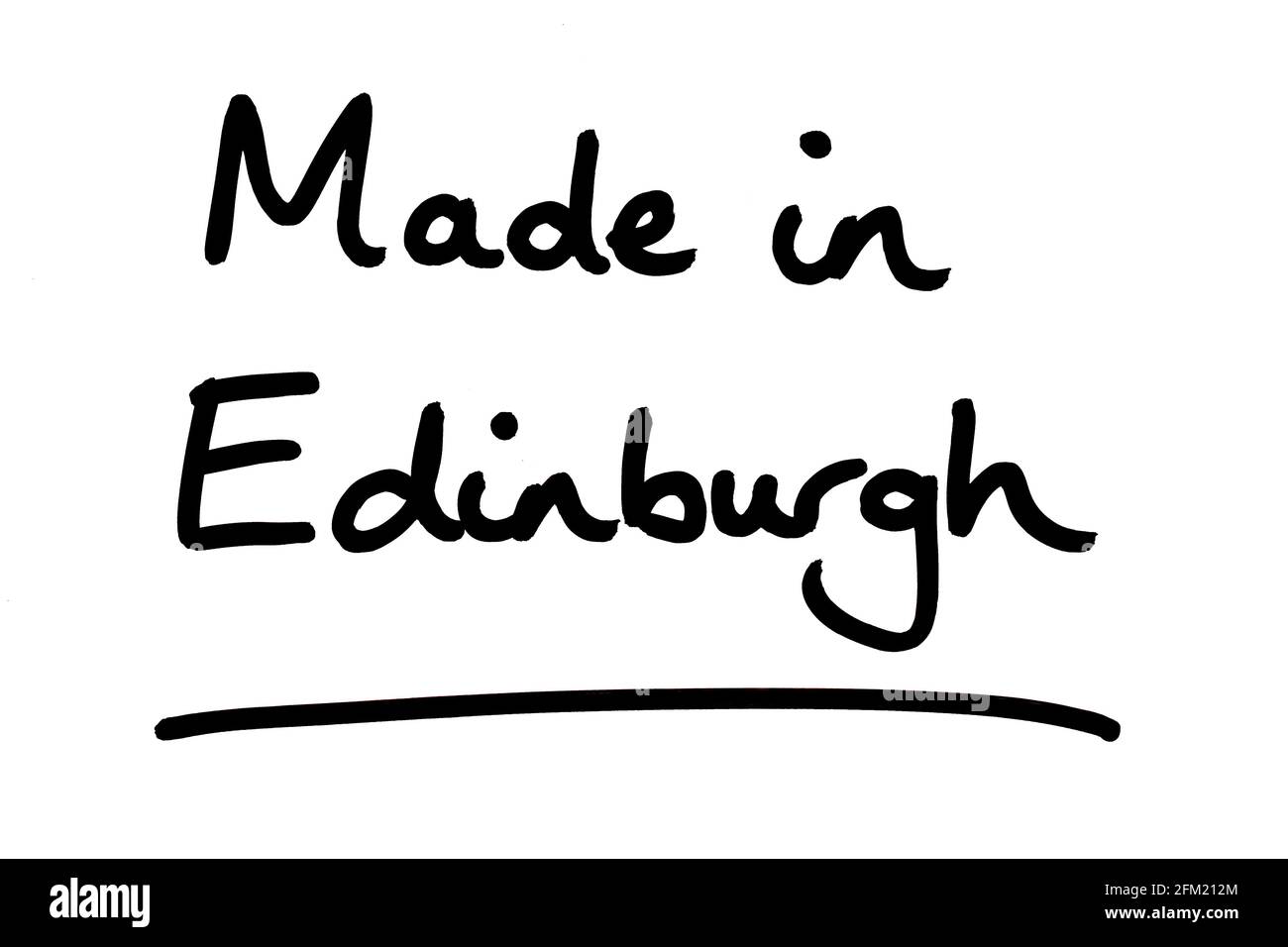 Hergestellt in Edinburgh, handgeschrieben auf weißem Hintergrund. Stockfoto