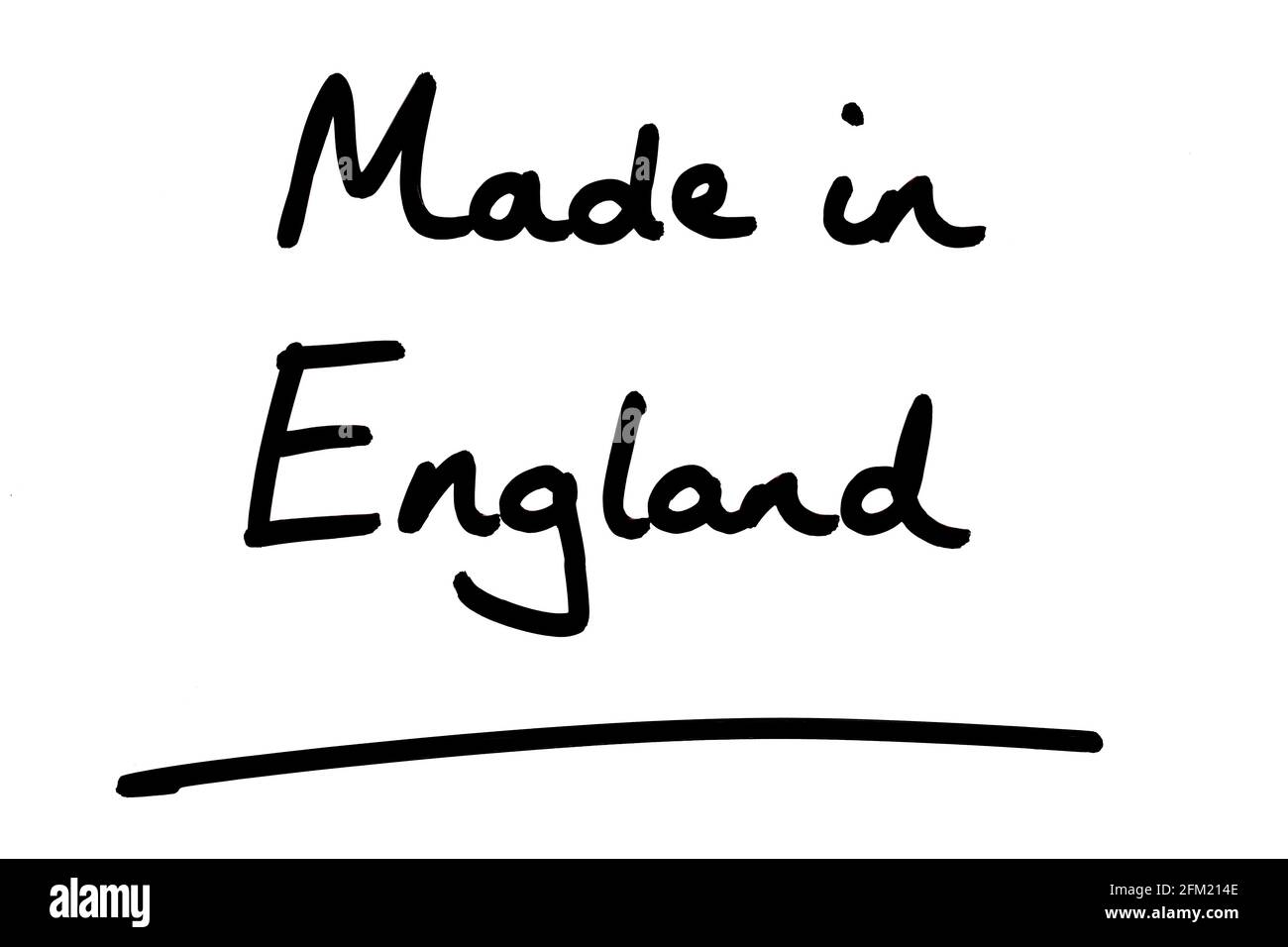 Hergestellt in England, handgeschrieben auf weißem Hintergrund. Stockfoto