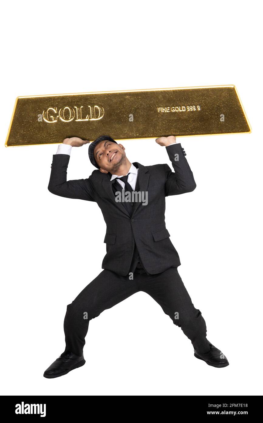 Kommunizieren Sie Investitionen und Handel Aktien, Gold und Silber.EIN Mann, der Gold über den Kopf mit Stärke. In voller Höhe mit Abklingparh Stockfoto