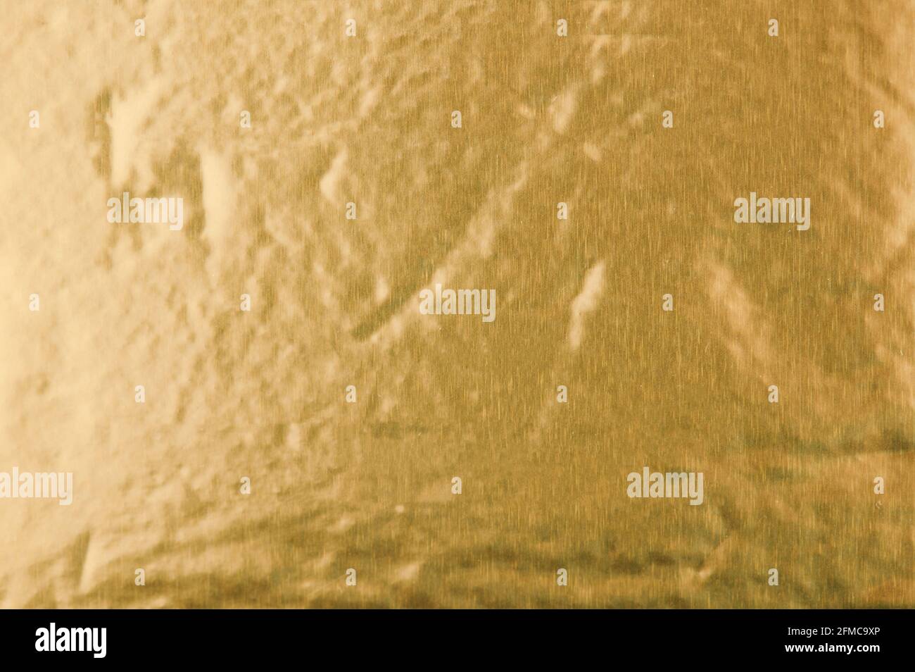 Gold Farbe glänzend metallische Oberfläche Makro Textur Hintergrund Stockfoto