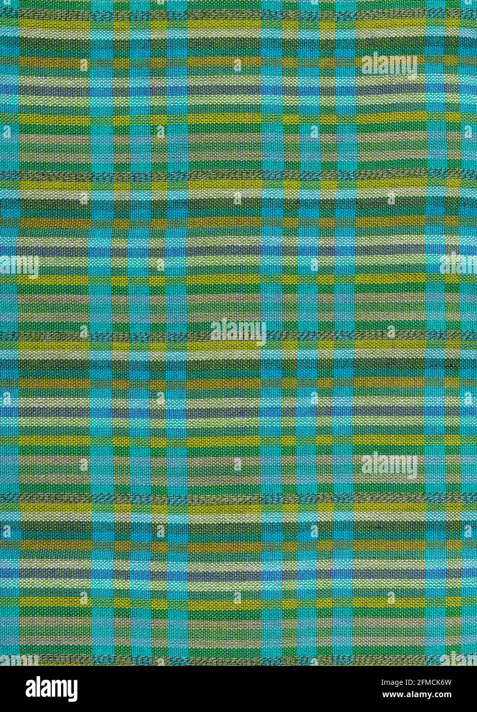 Ein flacher Bereich aus gewebtem Stoff als Hintergrundstruktur Und Muster in Grün und Blau Stockfoto