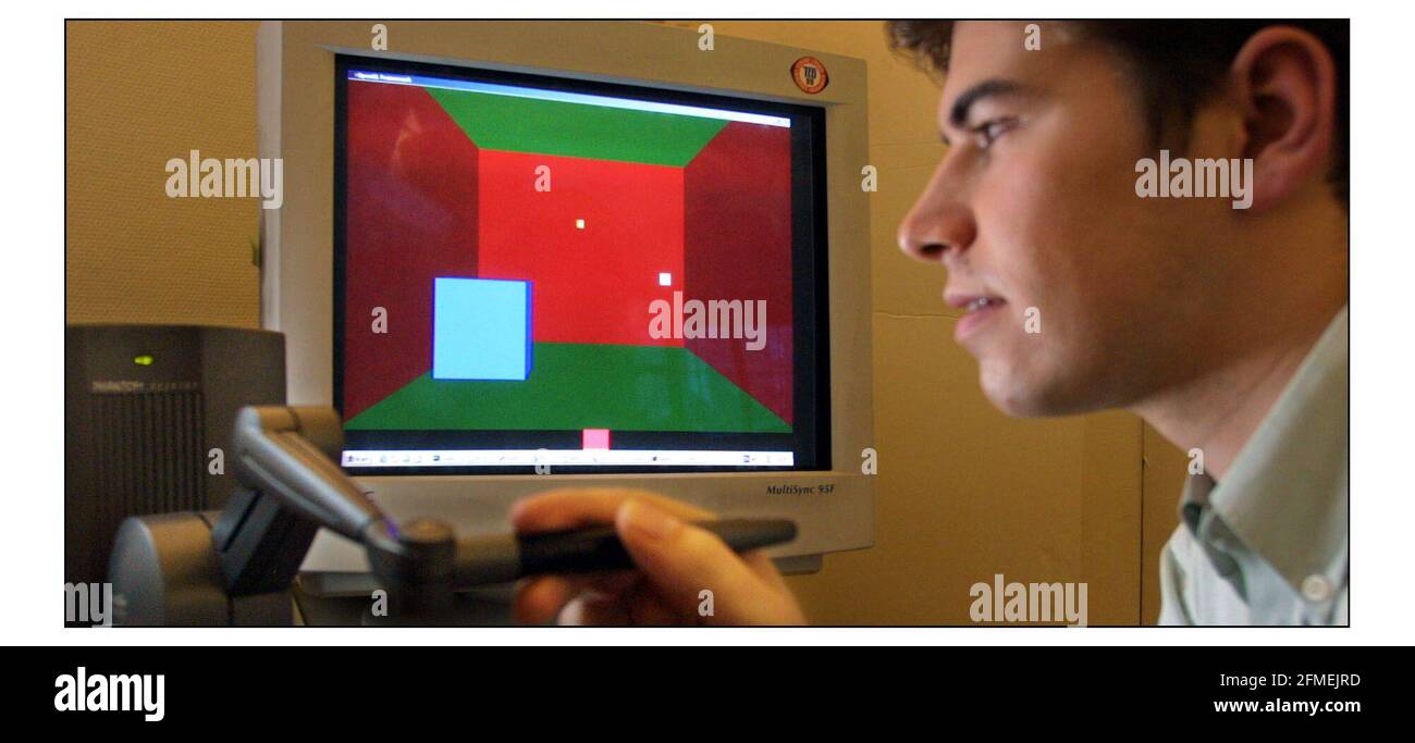 Joel Jordan im Department of Computer Science am University College London  verwendet einen hochentwickelten Joy Stick namens Heptic Device, der  Berührungen in einer virtuellen Umgebung simuliert. Seine Co-Präsenz ist  Jung Kim in