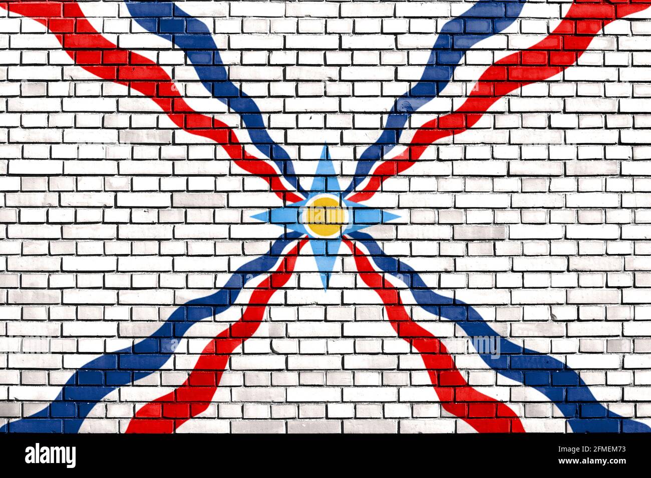 Flagge der Assyrer auf Ziegelmauer gemalt Stockfoto