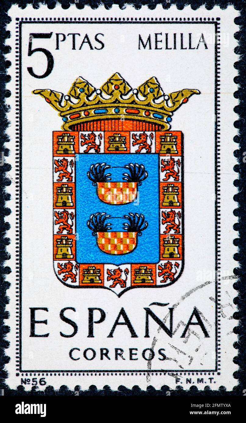 SPANIEN - UM 1966: Eine in Spanien gedruckte Briefmarke, die den Wappen der Provinzhauptstädte gewidmet ist, zeigt Melilla Stockfoto