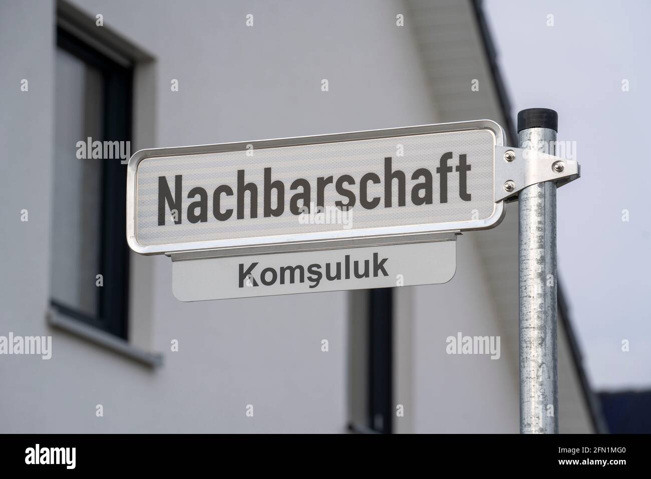 Straßenschild, Nachbarschaft, in deutsch und türkisch, Neues Wohnviertel mit 150 Grundstücken, auf dem Gelände der ehemaligen Mine der RG Lohberg in Dinslaken, Th Stockfoto