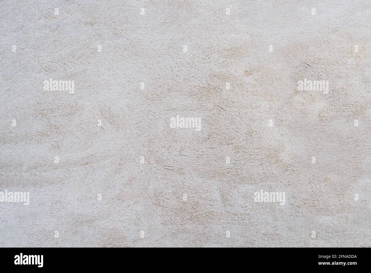 Weiße und graue Betonwand ist eine dekorative oder strukturierte Oberfläche. Kann als Hintergrund oder für Designzwecke verwendet werden Stockfoto